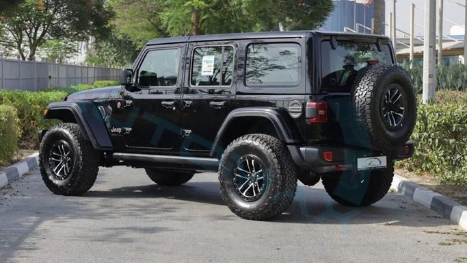 New Jeep Wrangler IV (JL) Facelift, 2.0 l, 2025 in Dubai by Auto Max Group, Black color. GCC Specs | AUTO.AE