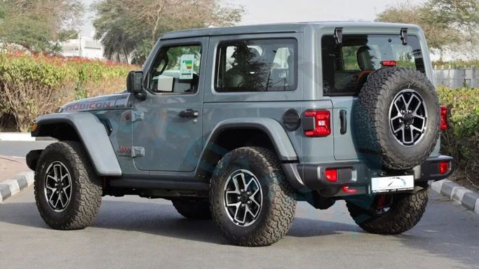 Новый Jeep Wrangler IV (JL) Рестайлинг, 2.0 л, 2025 в Дубае от Auto Max Group Серый цвет. GCC | AUTO.AE