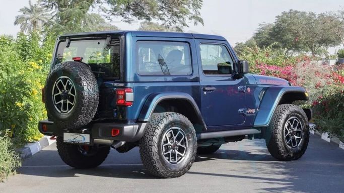 New Jeep Wrangler IV (JL) Facelift, 2.0 l, 2025 in Dubai by Auto Max Group, Light Blue color. GCC Specs | AUTO.AE