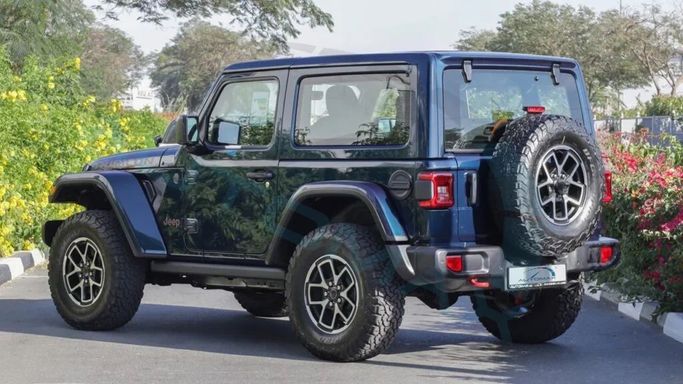 New Jeep Wrangler IV (JL) Facelift, 2.0 l, 2025 in Dubai by Auto Max Group, Light Blue color. GCC Specs | AUTO.AE