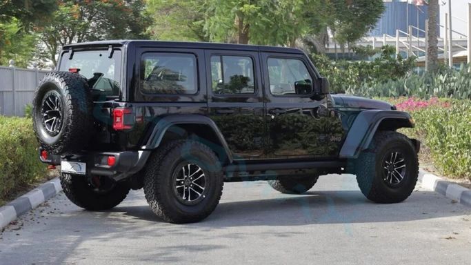 New Jeep Wrangler IV (JL) Facelift, 2.0 l, 2025 in Dubai by Auto Max Group, Black color. GCC Specs | AUTO.AE