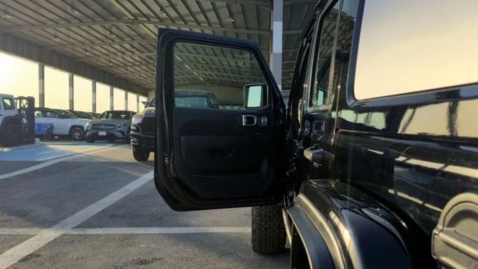 New Jeep Wrangler IV (JL) Facelift, 2.0 l, 2024 in Dubai by Auto Max Group, Black color. GCC Specs | AUTO.AE