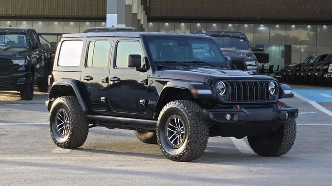 New Jeep Wrangler IV (JL) Facelift, 2.0 l, 2024 in Dubai by Auto Max Group, Black color. GCC Specs | AUTO.AE