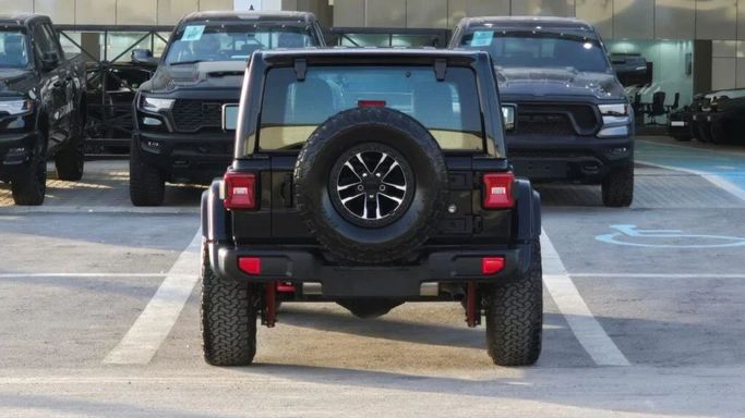 New Jeep Wrangler IV (JL) Facelift, 2.0 l, 2024 in Dubai by Auto Max Group, Black color. GCC Specs | AUTO.AE