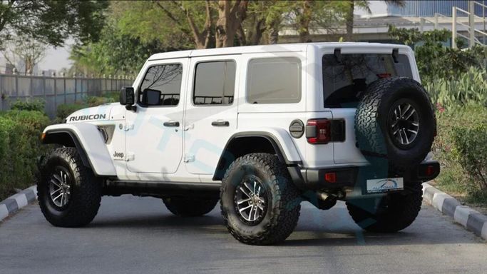 New Jeep Wrangler IV (JL) Facelift, 6.4 l, 2024 in Dubai by Auto Max Group, White color. GCC Specs | AUTO.AE