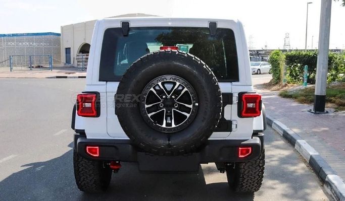 New Jeep Wrangler IV (JL) Facelift, 2.0 l, 2024 in Dubai by Segrex Auto, White color. GCC Specs | AUTO.AE
