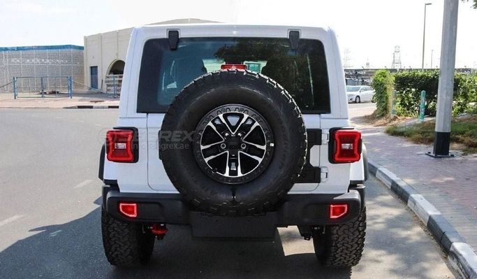 Used Jeep Wrangler IV (JL) Facelift, 2.0 l, 2024 in Dubai by Segrex Auto, White color. GCC Specs | AUTO.AE