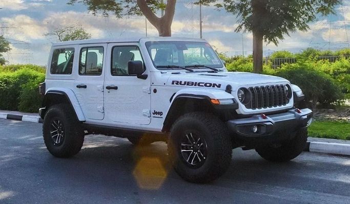 New Jeep Wrangler IV (JL) Facelift, 2.0 l, 2024 in Dubai by Segrex Auto, White color. GCC Specs | AUTO.AE