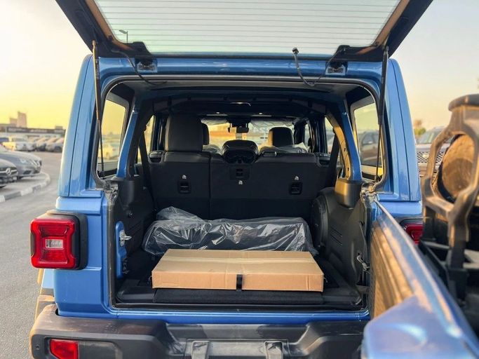 New Jeep Wrangler IV (JL) Facelift, 6.4 l, 2025 in Dubai by Al Rawnaq Motors , Blue color. GCC Specs | AUTO.AE