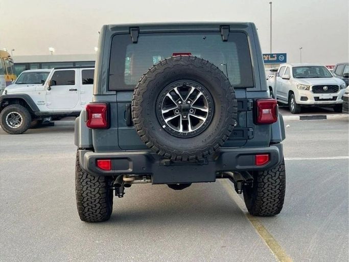 New Jeep Wrangler IV (JL) Facelift, 6.4 l, 2024 in Dubai by Al Rawnaq Motors , Grey color. GCC Specs | AUTO.AE