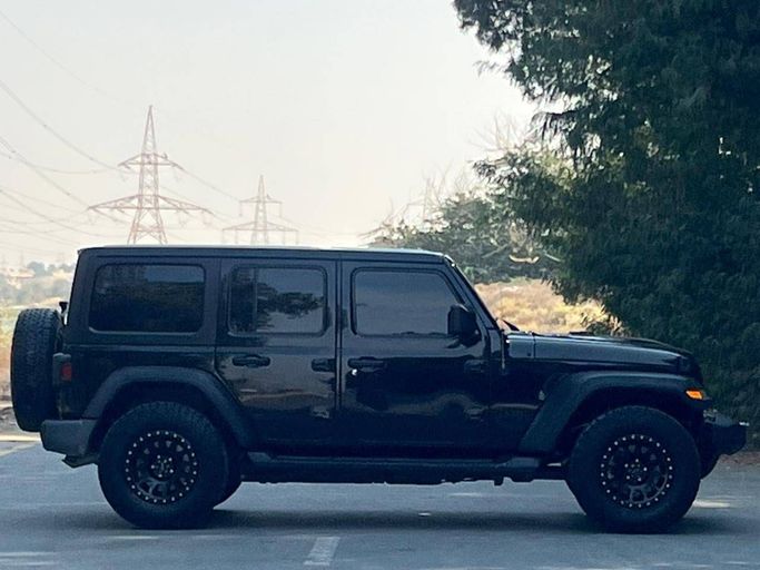 Подержанный Jeep Wrangler IV (JL), 3.6 л, 2021 в Дубае от Prestige Motos (SHJ) Черный цвет. Американская | AUTO.AE