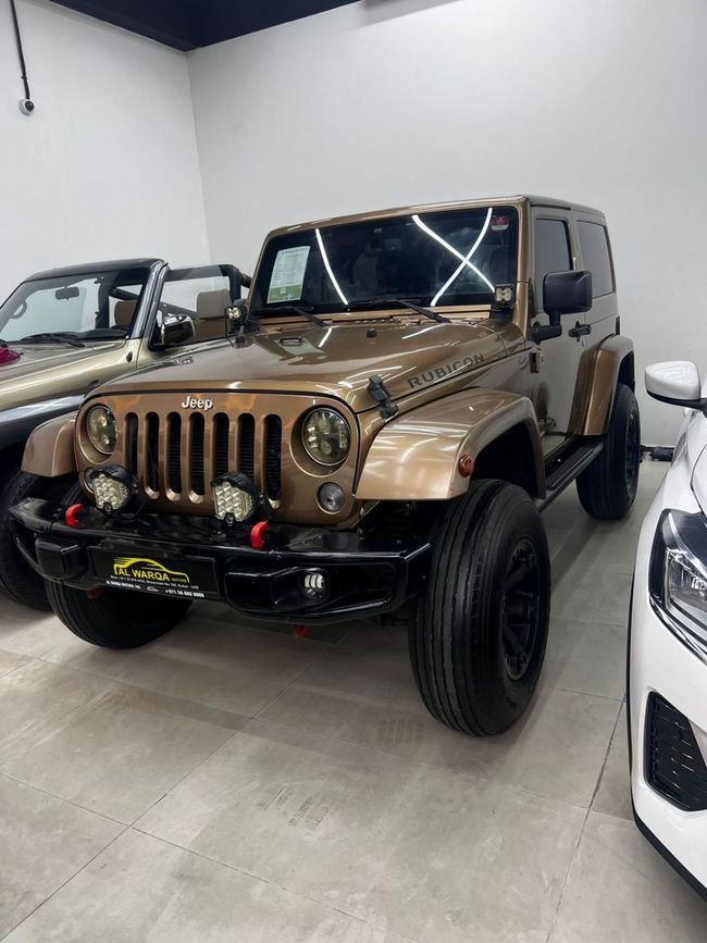 مستعملة Jeep Wrangler III (JK), 3.6 l, 2015 في في دبي من Al Warqa Used Cars LLC، اللون ذهبي. مواصفات الخليج | AUTO.AE | إعلان #272439