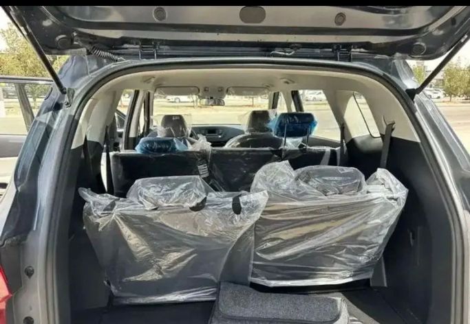 New Kia Carens IV (KY), 1.5 l, 2023 in Dubai by Mohamed Hakim Motors, Light Blue color. GCC Specs | AUTO.AE