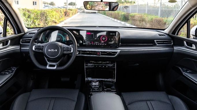 New Kia K5 III, 1.5 l, 2025 in Dubai by Altass Motors, White color. Other | AUTO.AE