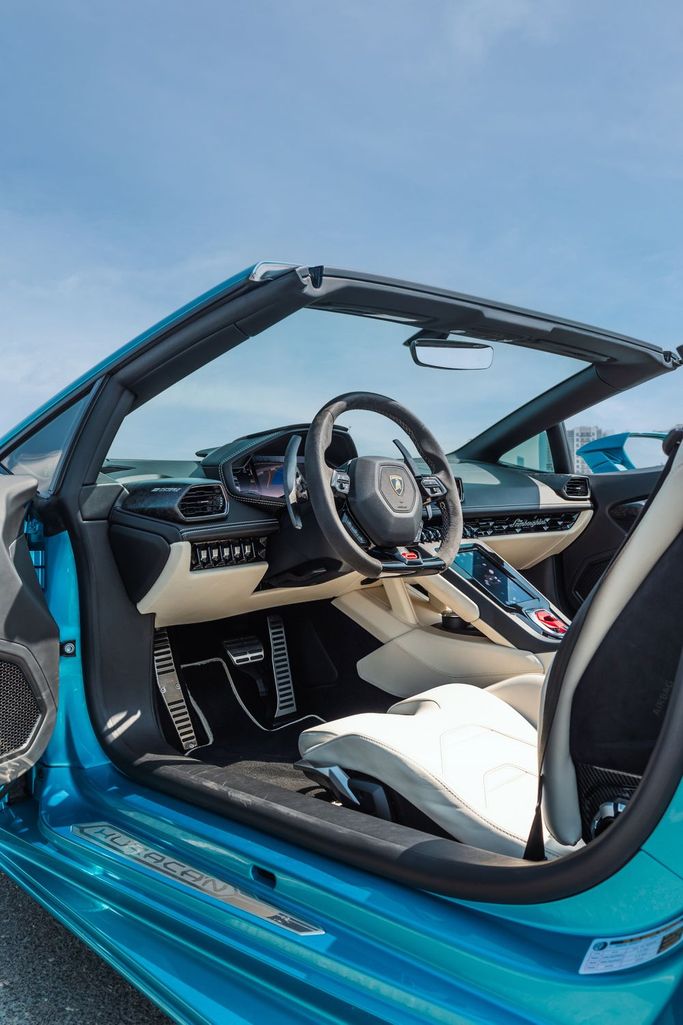 Lamborghini Huracán I, 2024 sport roadster for rent in Dubai by POF RENTAL, light blue color | AUTO.AE