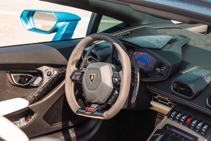 Lamborghini Huracán I, 2024 sport roadster for rent in Dubai by POF RENTAL, light blue color | AUTO.AE