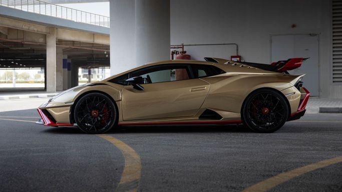 Lamborghini Huracán I, 2022 sport coupe for rent in Dubai by AVA car rental, golden color | AUTO.AE