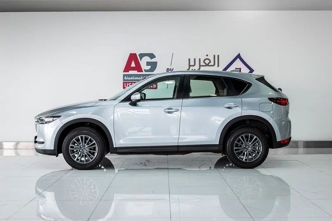 Подержанный Mazda CX-5 II Рестайлинг, 2.5 л, 2023 в Дубае от AG Motors Серебристый цвет. GCC | AUTO.AE
