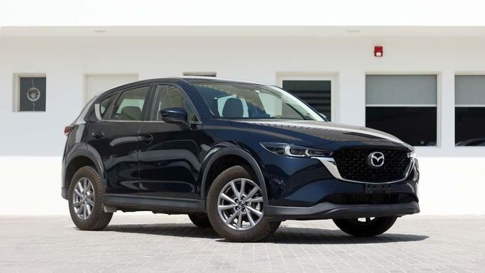 Used Mazda CX-5 II Facelift, 2.5 l, 2023 in Dubai by Cariva Used Cars , Navy Blue color. GCC Specs | AUTO.AE