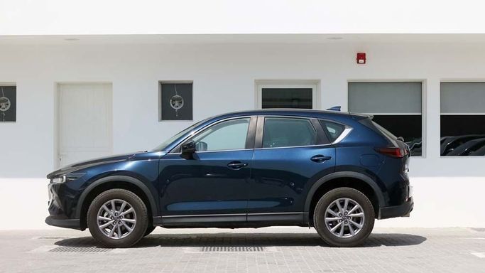 Used Mazda CX-5 II Facelift, 2.5 l, 2023 in Dubai by Cariva Used Cars , Navy Blue color. GCC Specs | AUTO.AE