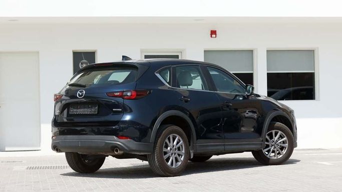 Used Mazda CX-5 II Facelift, 2.5 l, 2023 in Dubai by Cariva Used Cars , Navy Blue color. GCC Specs | AUTO.AE