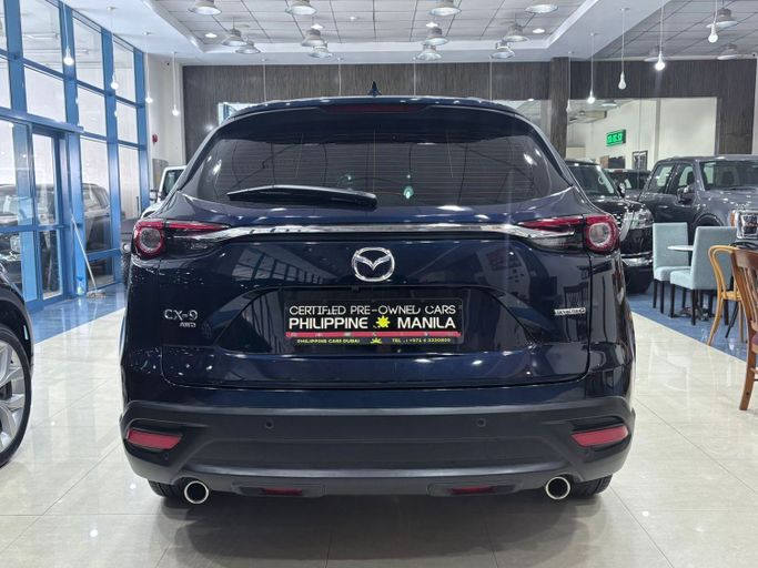 Подержанный Mazda CX-9 II Рестайлинг, 2.5 л, 2024 в Дубае от Philippine Used Cars Showroom Тёмно-синий цвет. GCC | AUTO.AE
