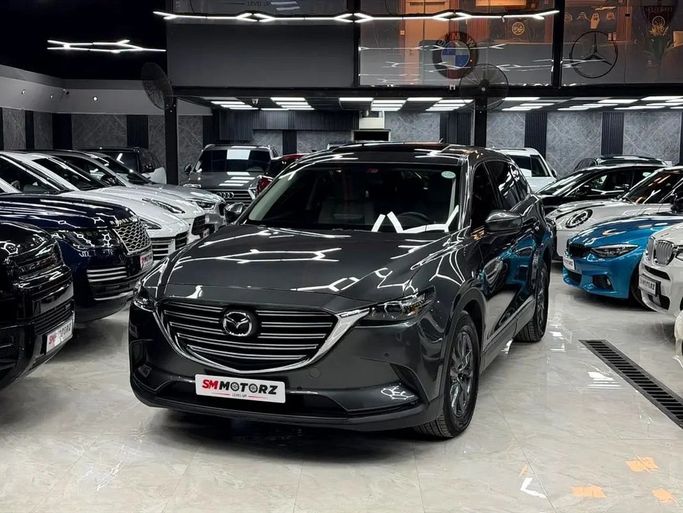 Подержанный Mazda CX-9 II Рестайлинг, 2.5 л, 2022 в Дубае от SM MOTORZ Серый цвет. GCC | AUTO.AE