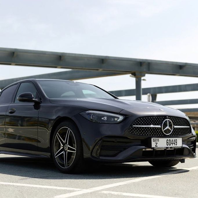 Mercedes-Benz C-Class 200 V (W206), 2023 standard sedan for rent in Dubai by Sydney Rent A Car, black color | AUTO.AE