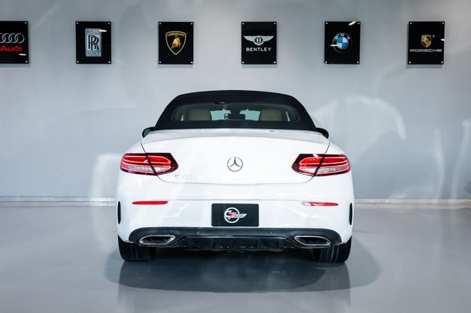 Used Mercedes-Benz C-Class 300 IV (W205) Facelift, 2.0 l, 2021 in Dubai by C7 Motors, White color. American Specs | AUTO.AE