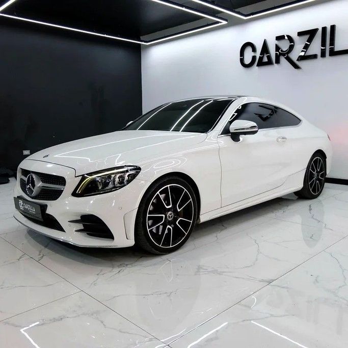 Used Mercedes-Benz C-Class 300 IV (W205) Facelift, 2.0 l, 2019 in Dubai by Carzilla Motors, White color. GCC Specs | AUTO.AE