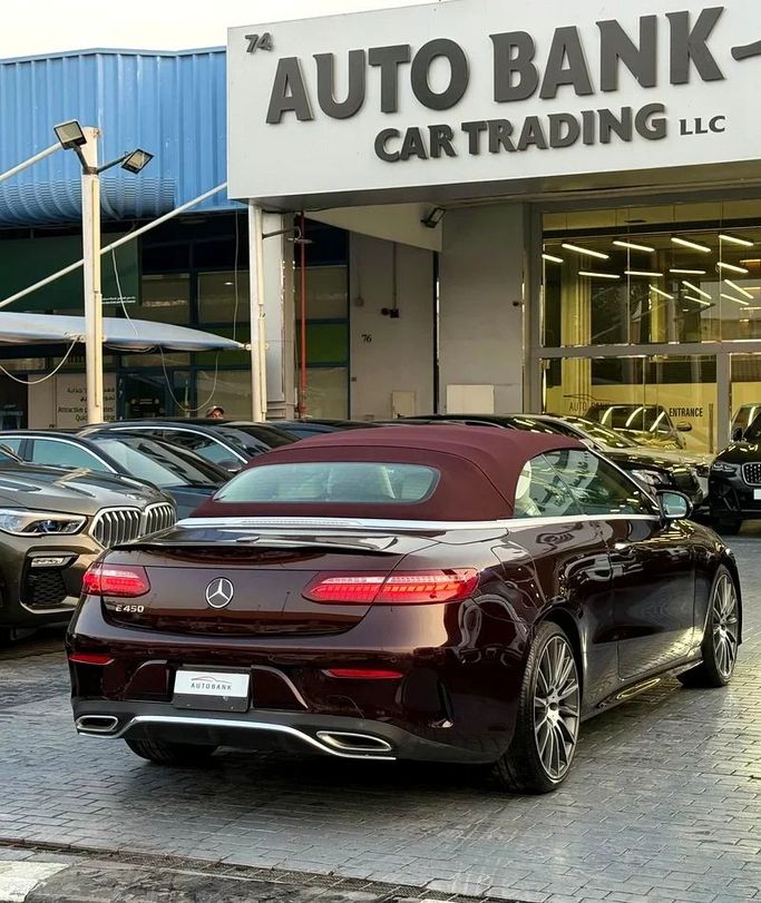 Used Mercedes-Benz E-Class 450 V (W213, S213, C238) Facelift, 3.0 l, 2023 in Dubai by Auto Bank Motors, Burgundy color. American Specs | AUTO.AE