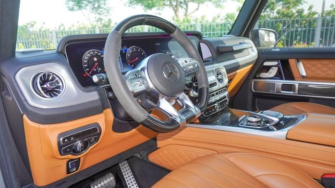 Подержанный Mercedes-Benz G-Class AMG 63 AMG II (W463), 4.0 л, 2021 в Дубае от Najem Motors Серый цвет. GCC | AUTO.AE