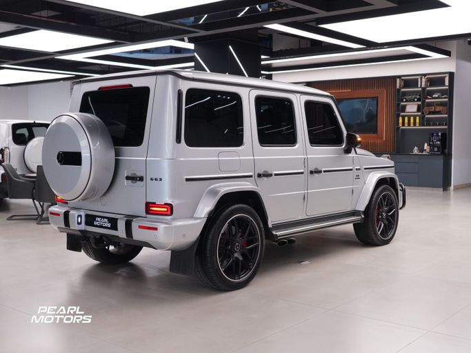 Подержанный Mercedes-Benz G-Class AMG 63 AMG II (W463), 4.0 л, 2023 в Дубае от Pearl Motors Серебристый цвет. GCC | AUTO.AE