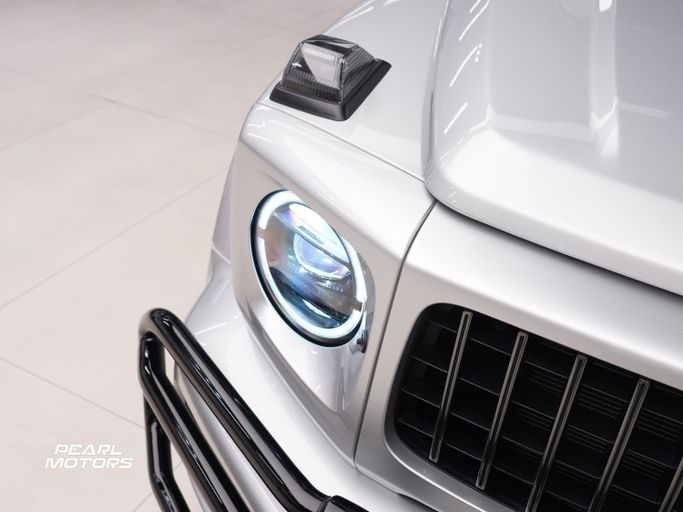 Подержанный Mercedes-Benz G-Class AMG 63 AMG II (W463), 4.0 л, 2023 в Дубае от Pearl Motors Серебристый цвет. GCC | AUTO.AE