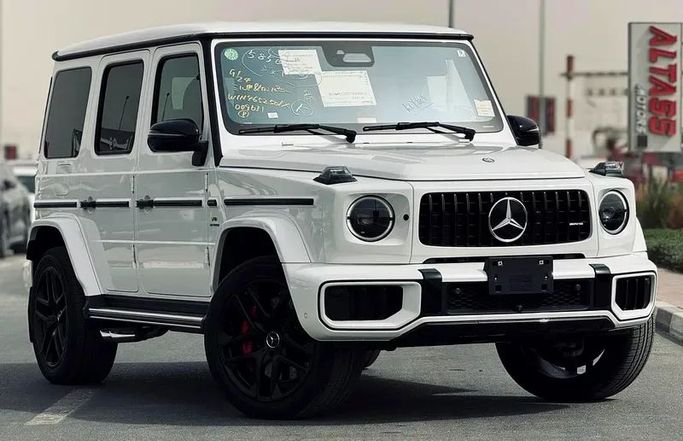 Подержанный Mercedes-Benz G-Class AMG 63 AMG II (W465) Рестайлинг, 4.0 л, 2025 в Дубае от Mirza Automobile FZE Белый цвет. Японская | AUTO.AE
