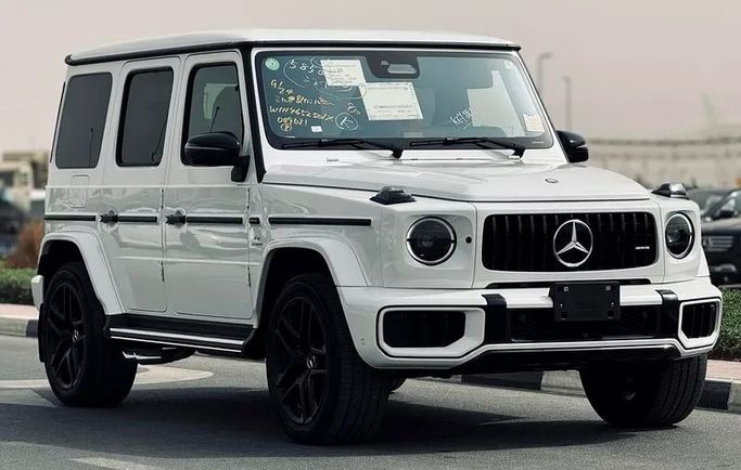 Подержанный Mercedes-Benz G-Class AMG 63 AMG II (W465) Рестайлинг, 4.0 л, 2025 в Дубае от Mirza Automobile FZE Белый цвет. Японская | AUTO.AE