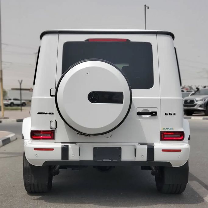 Used Mercedes-Benz G-Class AMG 63 AMG II (W463), 4.0 l, 2023 in Dubai by Japan Motors, White color. Japanese Specs | AUTO.AE