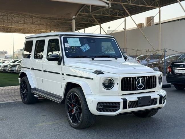 Подержанный Mercedes-Benz G-Class AMG 63 AMG II (W463), 4.0 л, 2019 в Дубае от HONEY Motors FZCO Белый цвет. Японская | AUTO.AE