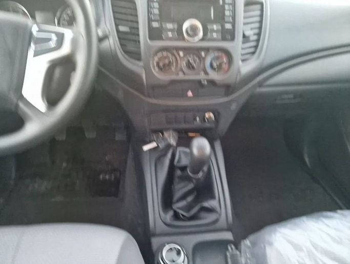 New Mitsubishi L200 V Facelift, 2.4 l, 2023 in Dubai by Mohamed Hakim Motors, White color. GCC Specs | AUTO.AE