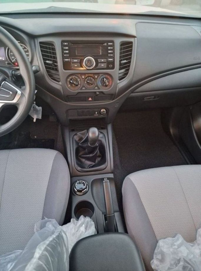 New Mitsubishi L200 V Facelift, 2.4 l, 2023 in Dubai by Mohamed Hakim Motors, White color. GCC Specs | AUTO.AE