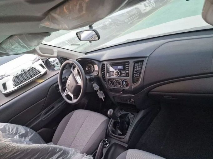 New Mitsubishi L200 V Facelift, 2.4 l, 2023 in Dubai by Mohamed Hakim Motors, White color. GCC Specs | AUTO.AE