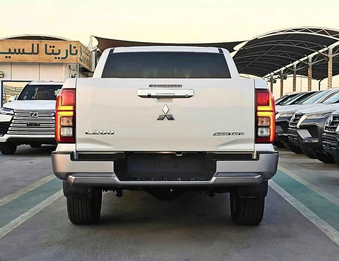 New Mitsubishi L200 VI, 2.4 l, 2024 in Dubai by SK Motors, White color. GCC Specs | AUTO.AE