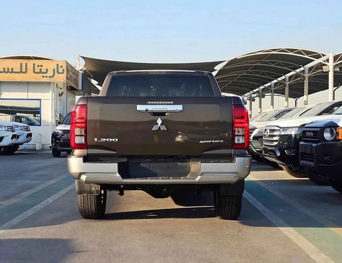 New Mitsubishi L200 VI, 2.4 l, 2024 in Dubai by SK Motors, Brown color. GCC Specs | AUTO.AE