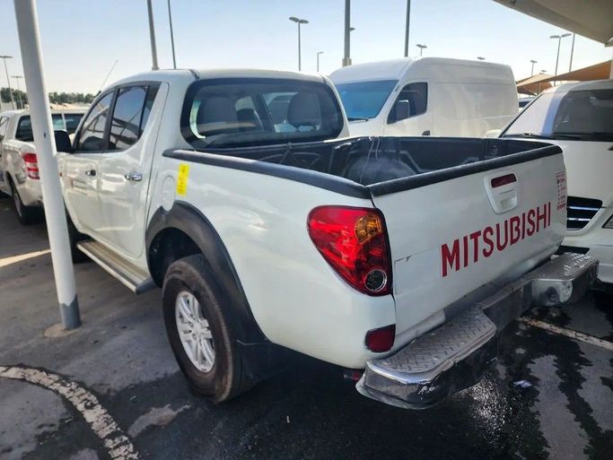 Подержанный Mitsubishi L200 IV, 2.5 л, 2008 в Дубае от Abdo Al Muthanna Used Cars Белый цвет. GCC | AUTO.AE
