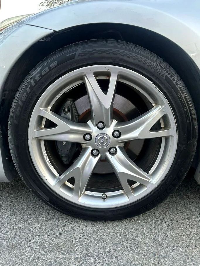 Подержанный Nissan 370Z I, 3.7 л, 2011 в Дубае от First Choice Motors Серебристый цвет. Американская | AUTO.AE