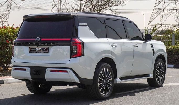 New Nissan Patrol VII (Y63), 3.8 l, 2025 in Dubai by Najem Motors, White color. GCC Specs | AUTO.AE