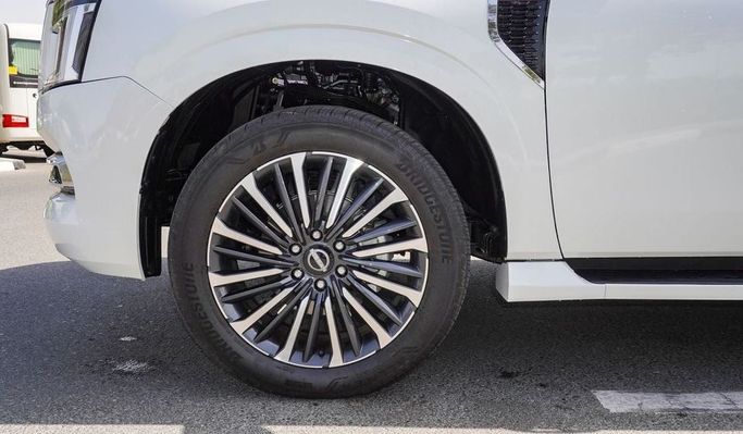 New Nissan Patrol VII (Y63), 3.8 l, 2025 in Dubai by Najem Motors, White color. GCC Specs | AUTO.AE