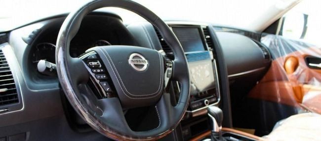 New Nissan Patrol VI (Y62) Facelift 2, 4.0 l, 2023 in Dubai by Falcons GT Motors FZCO, White color. GCC Specs | AUTO.AE