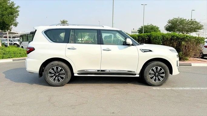Подержанный Nissan Patrol VI (Y62) Рестайлинг 2, 4.0 л, 2023 в Дубае от AG Motors Белый цвет. GCC | AUTO.AE