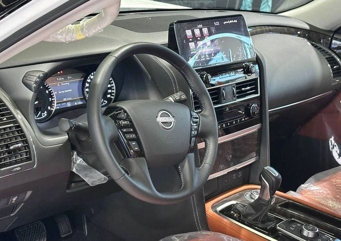 New Nissan Patrol VI (Y62) Facelift 2, 4.0 l, 2023 in Dubai by The One Motors, White color. GCC Specs | AUTO.AE